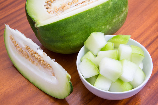 Winter melon slices in the bowl prepare to cooking on tableware made of wood