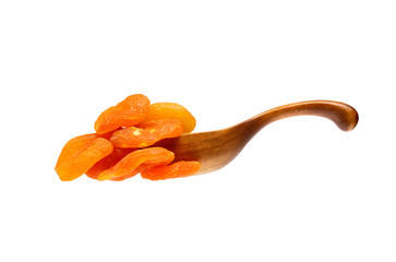 Dried apricots in the wooden spoon, isolated on white background