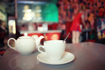 cup of tea at a cafe blurred background