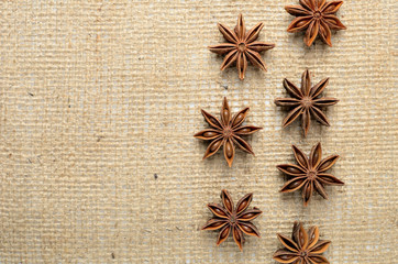 Star anise spices on burlap background