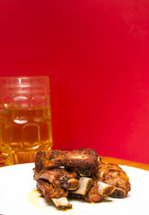 Roasted pork ribs on a white plate