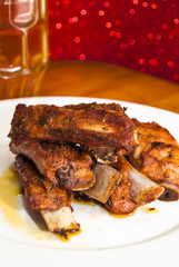 Roasted pork ribs on a white plate