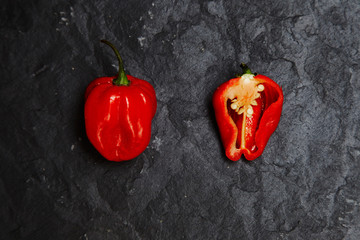 Splitted hot red pepper on stone