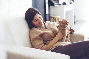 Woman resting with kitten