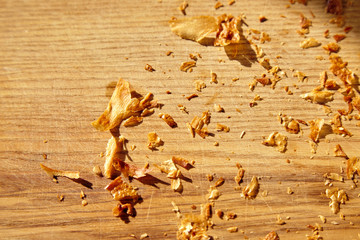 Croissant crumbles on the wooden plate