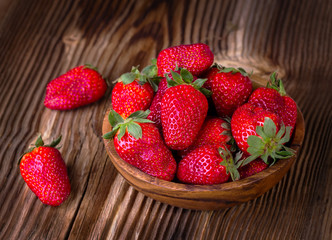 strawberry in a wooden plate