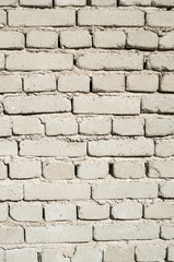 Wall of old white brick closeup