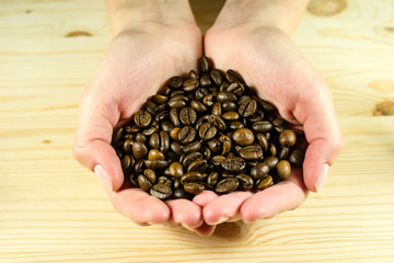 Coffee beans in hands