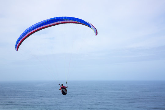 paragliding above the ocean
