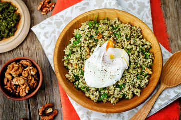 Basil nuts pesto quinoa with walnuts, parsley and poached egg