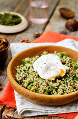 Basil nuts pesto quinoa with walnuts, parsley and poached egg
