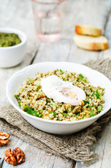 Basil nuts pesto quinoa with walnuts, parsley and poached egg