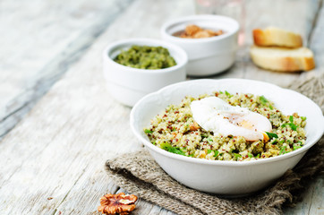 Basil nuts pesto quinoa with walnuts, parsley and poached egg