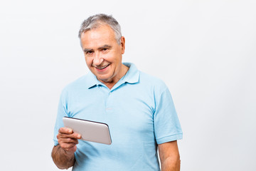 Senior man using digital tablet