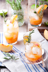 Peach and rosemary fizz cocktail