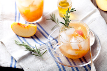 Peach and rosemary fizz cocktail