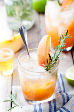 Peach and rosemary fizz cocktail