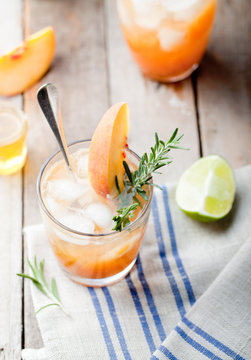 Peach and rosemary fizz cocktail
