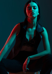 fashion girl red blue light in studio