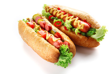 A pair of fresh hot dogs isolated on white