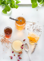 Honey variaty with bee's comb in a glass jurs