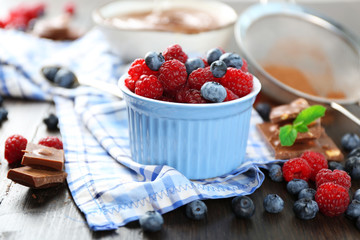 Beautiful composition with chocolate cream and ripe berries