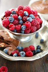 Beautiful composition with chocolate cream and ripe berries
