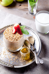 Flax seeds, oat pudding in a glass with berries