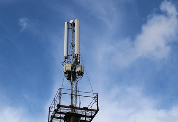 Fototapeta na wymiar telecommunications tower with blue sky