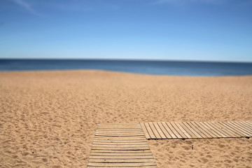 wooden pathway on the beach (blurred second plan- useful as a ba - obrazy, fototapety, plakaty