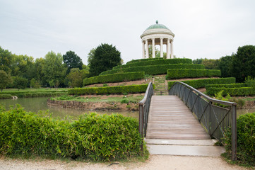 View of the small bridge leading to the little temple inside Querini park in Vicenza