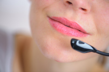 Woman using a telephone head set
