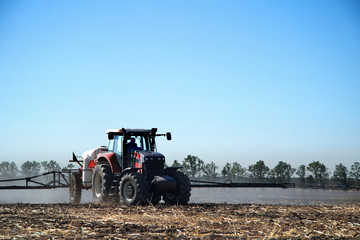The tractor works in a field