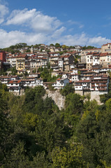 Fototapeta na wymiar Town houses built on mountainside slope landscape