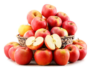 Apples in wicker basket isolated on white