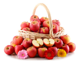 Apples in wicker basket isolated on white