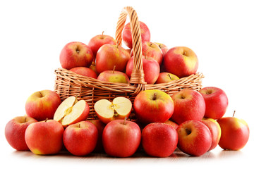 Apples in wicker basket isolated on white