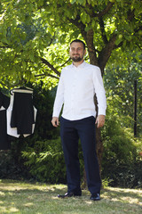 Groom with his wedding presentable clothes.  Getting ready for wedding.