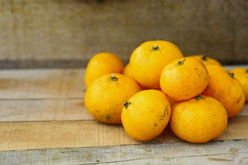 Fresh orange on wooden table in dining room. Healthy fruit for lose weight ,Fresh oranges on wooden background.
