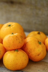 Fresh orange on wooden table in dining room. Healthy fruit for lose weight ,Fresh oranges on wooden background.