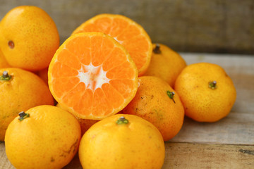 Fresh orange on wooden table in dining room. Healthy fruit for lose weight ,Fresh oranges on wooden background.