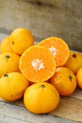 Fresh orange on wooden table in dining room. Healthy fruit for lose weight ,Fresh oranges on wooden background.