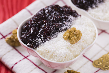 Rice Pudding and Strawberry Jam with Nuts, New Year Decoration in Red Color