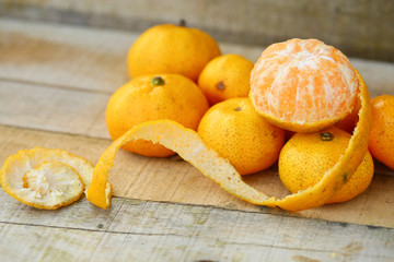 Naklejka na ściany i meble Fresh orange on wooden table in dining room. Healthy fruit for lose weight ,Fresh oranges on wooden background.