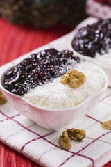 Rice Pudding and Strawberry Jam with Nuts, New Year Decoration in Red Color