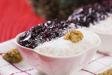 Rice Pudding and Strawberry Jam with Nuts, New Year Decoration in Red Color
