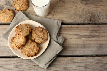 Homemade cookies and glass of milk on table close up