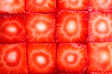 Fresh sliced strawberries cubes close up