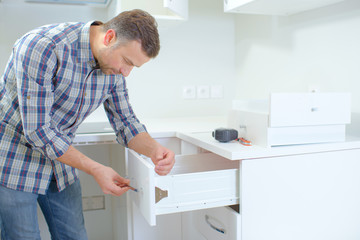 Man assembling furniture