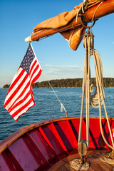 Fototapeta premium American flag waving from a sailboat 